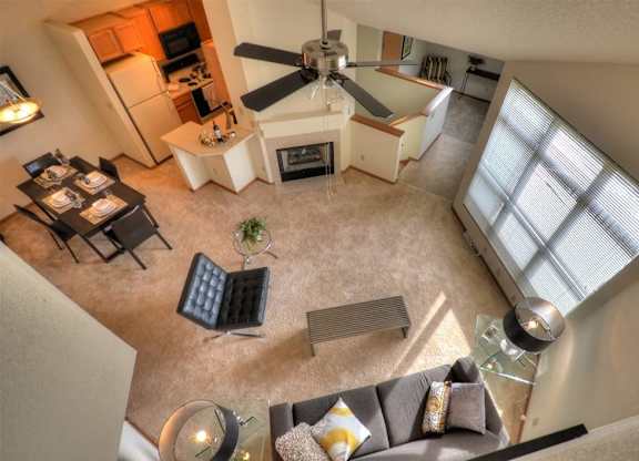 an overhead view of a living room with a ceiling fan