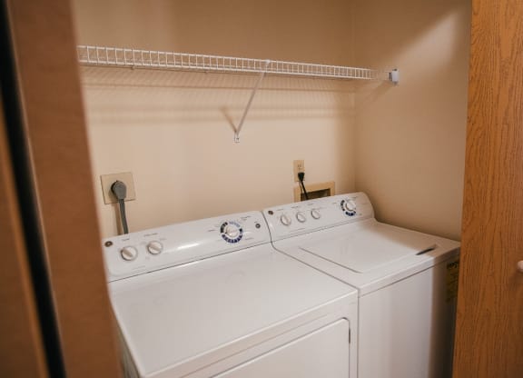 the washer and dryer in the laundry room of a home