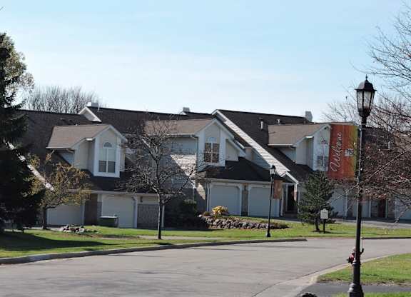 a row of houses on the side of a street
