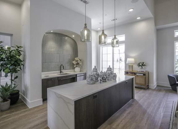 a kitchen with a large island in the middle