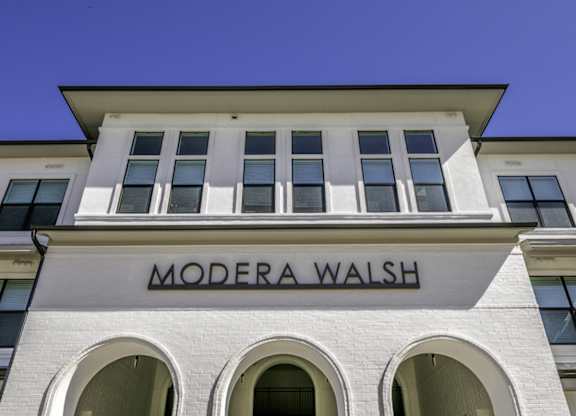 the facade of a building with a wall sign