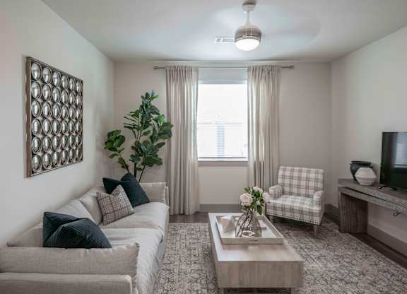 Open living area with Ceiling Fans