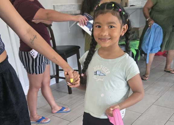 young girl in a green shirt at Crosby at Westchase Apartments, Houston Texas
