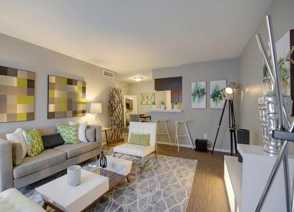 a modern living room with model furnishings at Crosby at Westchase Apartments in Houston