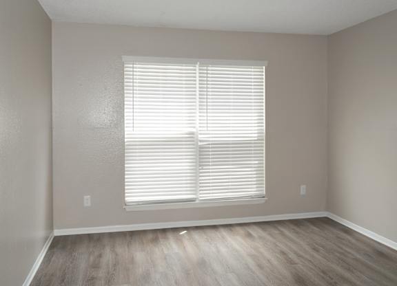 a bedroom with a large window at 12th and Beach