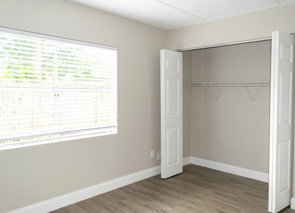 a spacious closet in a bedroom in a home at Pine Creek Apartments in South Daytona