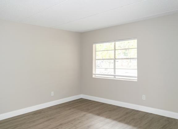 a bedroom with a window at Ridge Apartments