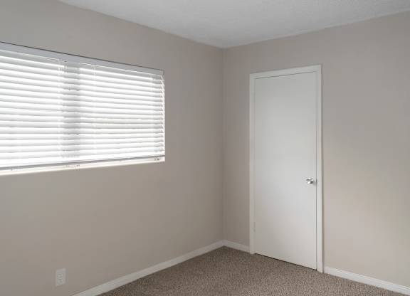 A bedroom with a window at Park Apartments