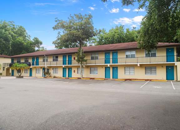 A parking lot in front of a well-kept residences at Ridge Apartments in South Daytona, FL
