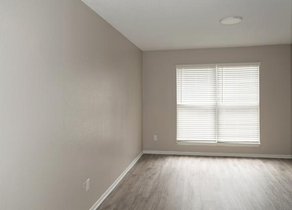A spacious apartment bedroom available at 12th and Beach apartments in daytona beach