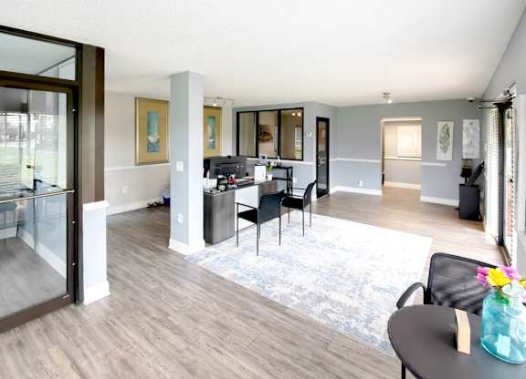 The leasing office at Waterview Crossing Apartments with desk, chairs, and sitting area