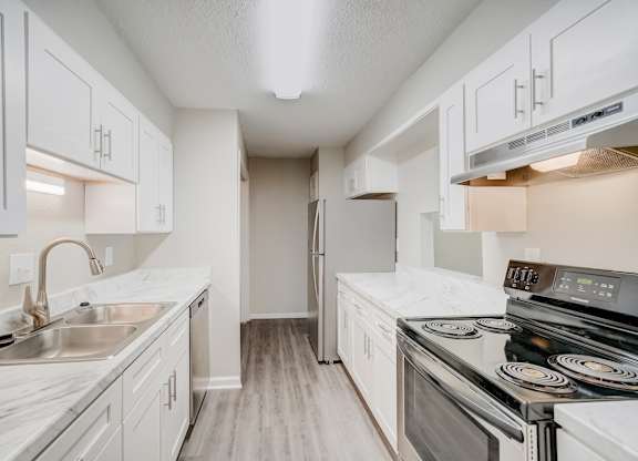a renovated kitchen with ample cabinetry at Hills at Hoover 35216