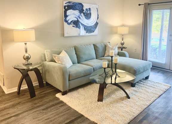 a living room with model furnishings at Hills at Hoover 35216