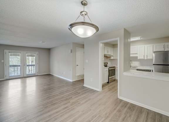 a large living room and kitchen with an open floor plan at Hills at Hoover 35216