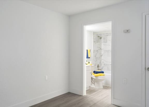 a bedroom with access to a bathroom in an apartment at Haven on Canal