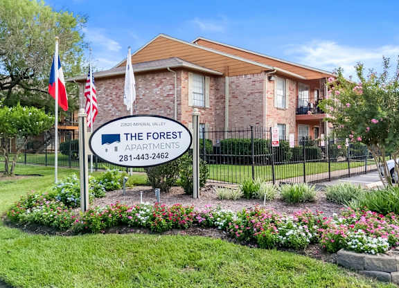 The community sign in front of The Forest Apartments in Houston, TX