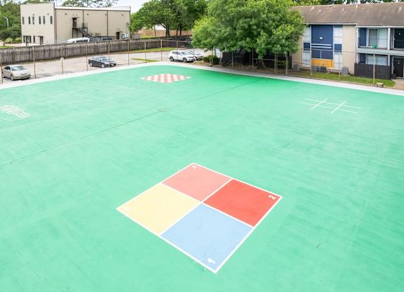 the spacious sports court at Pine Creek Apartments on Maxey Road