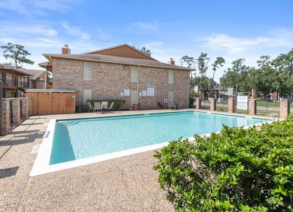 The large swimming pool and sundeck at The Forest Apartments