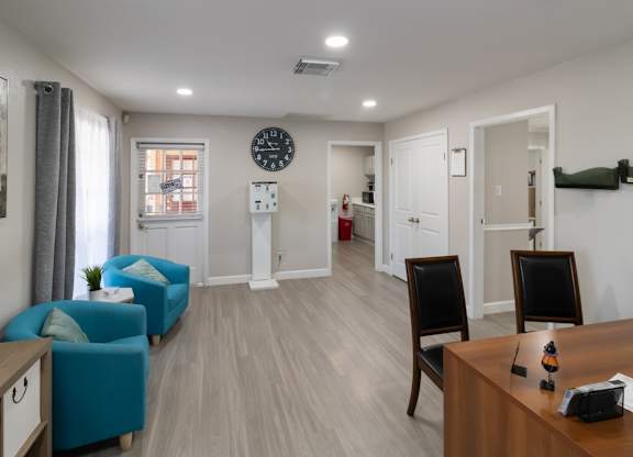 the leasing office with seating at The Forest Apartments in Houston, TX