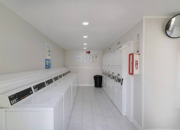 The on-site laundry center with washers and dryers at The Forest Apartments