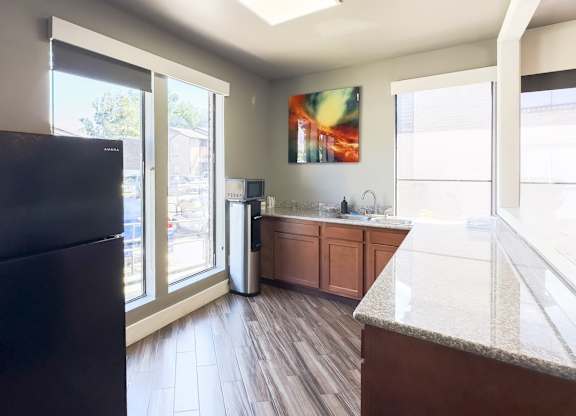 a kitchen area in the resident clubhouse at Hudson at Westchase Apartments in Houston, Texas