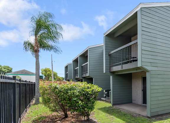 lush landscaping beside Winford Place residences with private patios and balconies