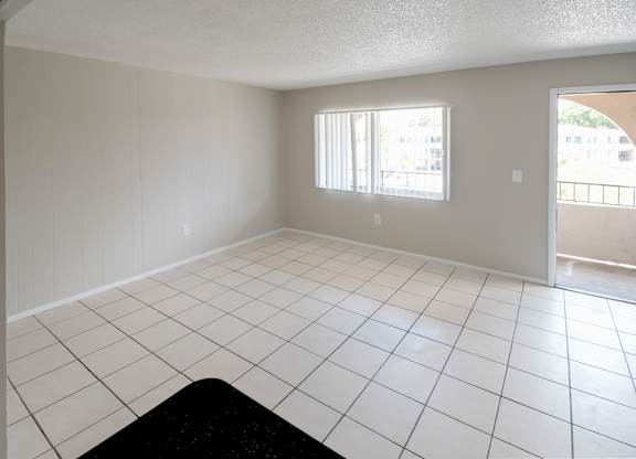 a tiled living room with a large window at Waterview Crossing