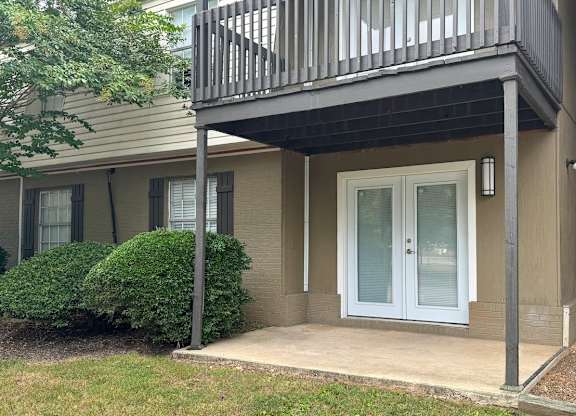 a front door of a house with a balcony at Spring Lake Cove Apartments, Alabama