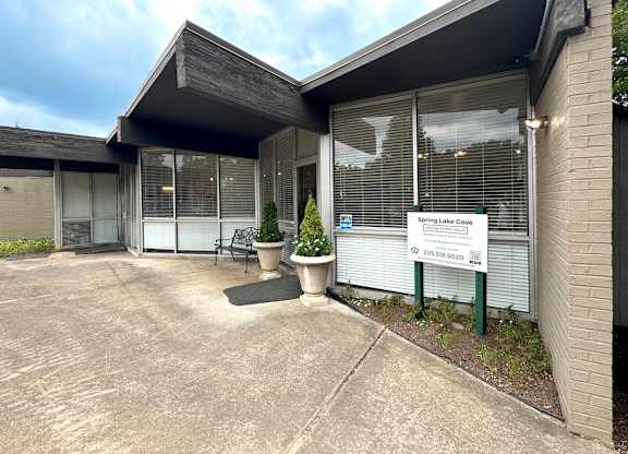 the front of a building with a driveway and a sign in front of it at Spring Lake Cove Apartments, Birmingham, AL 35215