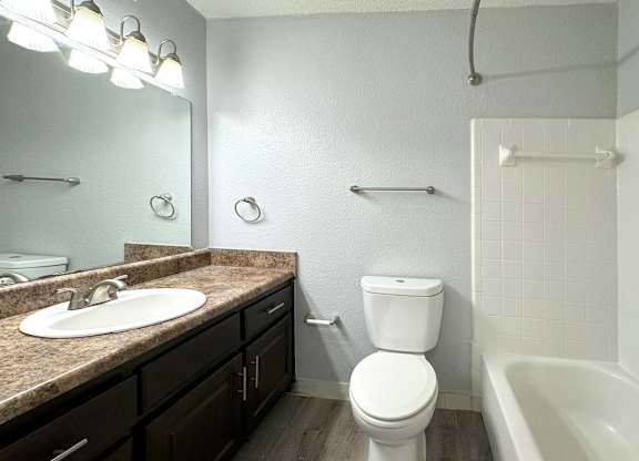 a bathroom with a sink toilet and a bath tub at Ascot Place Apartments, Alabama, 35235