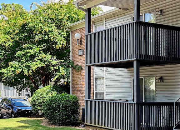 a balcony on the side of a apartment building at Ascot Place Apartments, Birmingham, 35235
