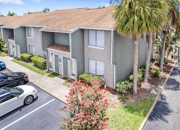 lush, tropical landscaping around residential buildings at Winford Place Apartments