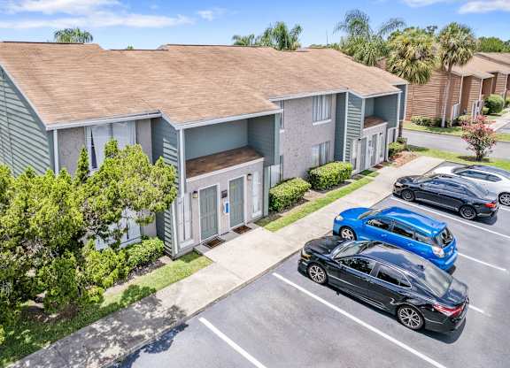 Well-kept residential buildings and ample parking at Winford Place Apartments in Orlando