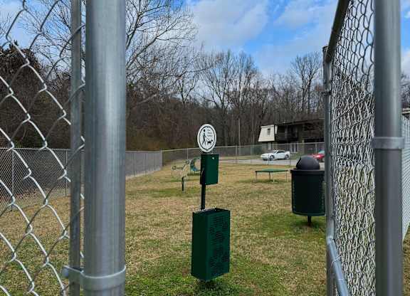 A chain link fence with a sign on it.