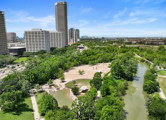 A cityscape with a river running through it.