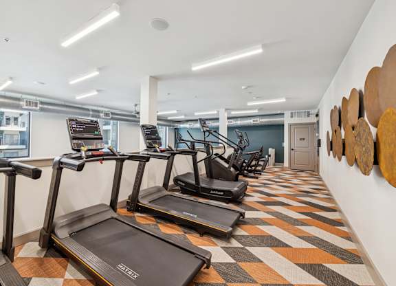 Fitness center treadmills at 1900 Parmer Apartments in Austin TX