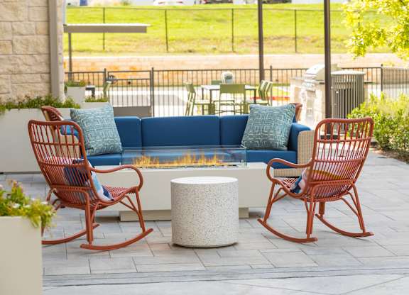 Outdoor patio seating at 1900 Parmer Apartments in Austin TX