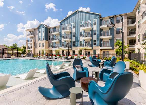 Poolside chairs at 1900 Parmer Apartments in Austin TX