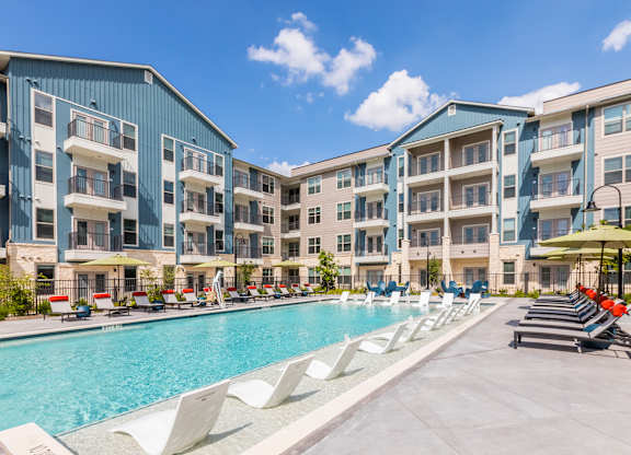 Poolside seating at 1900 Parmer Apartments in Austin TX