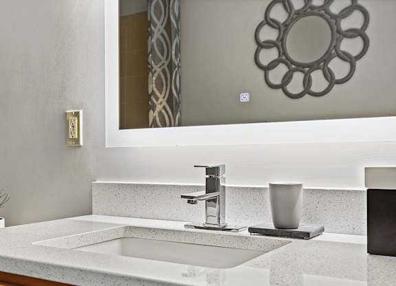 Bathroom vanity at Axis Admirals Hill Apartments in Chelsea MA