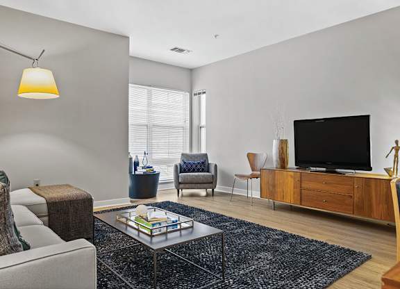 Living room at Axis Admirals Hill Apartments in Chelsea MA