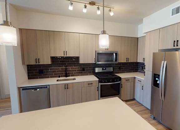 Kitchen with sleek appliances at Embark Apartments in Fremont CA