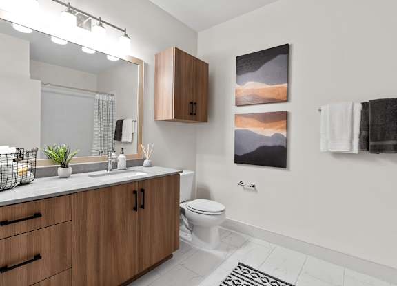 Bathroom with tiled flooring at VERO Apartments in Chelsea MA
