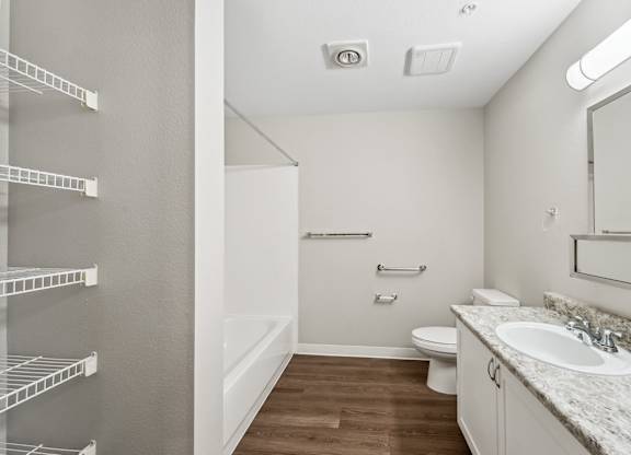 Bathroom with storage at Auburn Court Apartments in Auburn WA