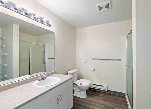 Bathroom with sink and shower at Ballinger Court Senior Apartments in Edmonds WA