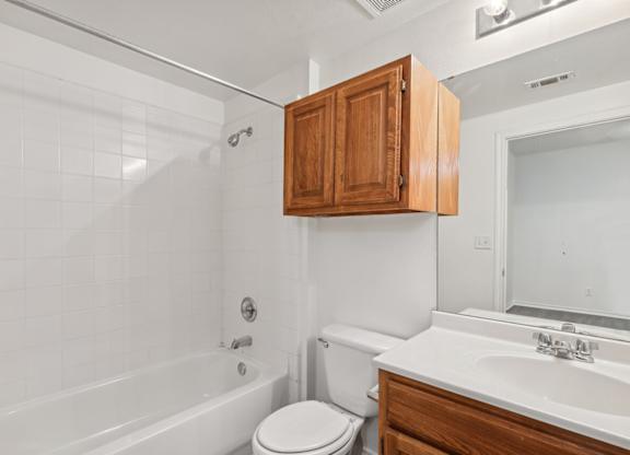 Bathroom with ample storage at Cypress View Villa Apartments in Weatherford TX