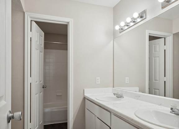 Bathroom with closet at Park Village Apartments in Conroe TX