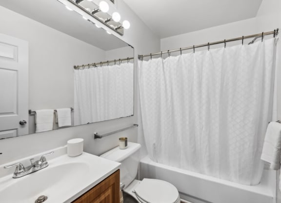 a bathroom with a sink toilet and a shower