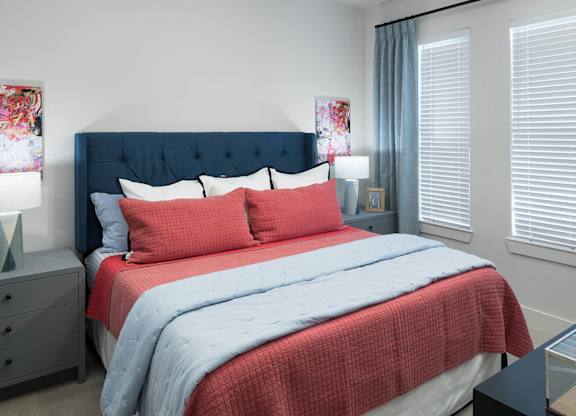 Bedroom with natural lighting at Jada Legacy Central Apartments in Plano TX