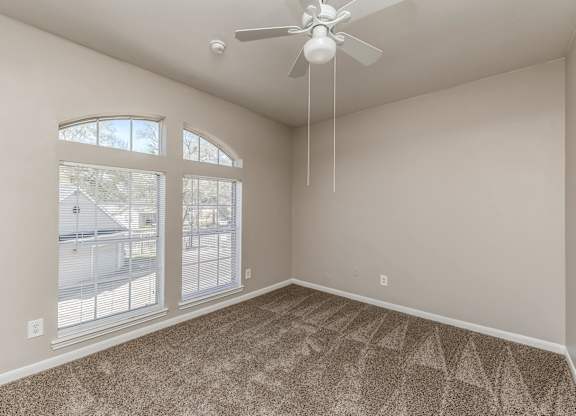 Bedroom with large window at Hollow Creek in Conroe TX